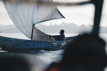 Close up beautiful view of the sailboat in sea in Africa. Ship with people is going fishing. Calm landscape. Blue boat