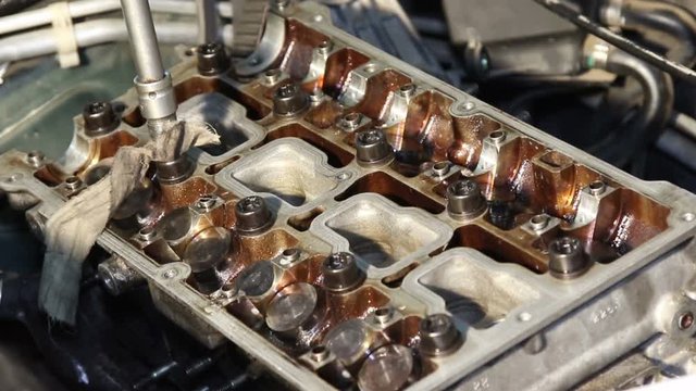Mechanic repairs the car engine