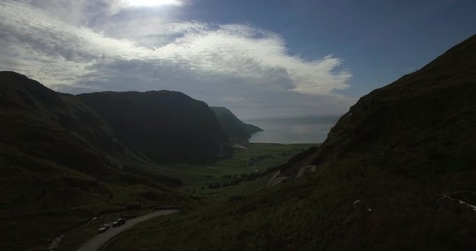 Beautiful road to Hoddevika. Droneshot with Hoddevik beach between high mountains. Hoddevika is in the most western place in Norway, between high mountains. One of the most beautiful places to surf.