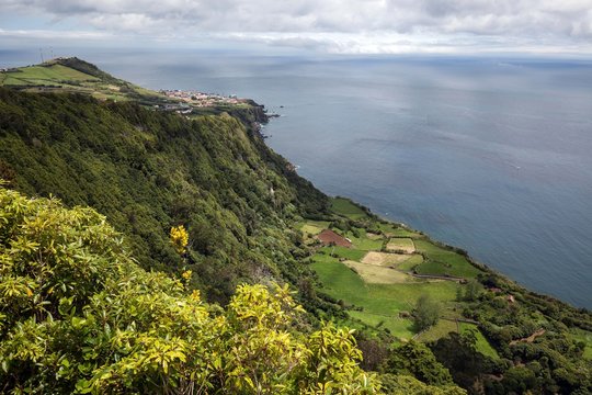 View from Miradouro da Faja do Conde to the east coast, in the back left the capital of Santa Cruz, island Flores, Azores, Portugal, Europe