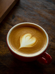 A cup of coffee with heart latte art