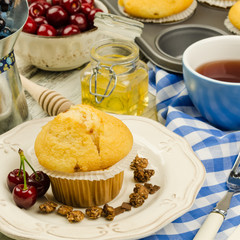Muffins and cup of tea and teapot. Tea time 