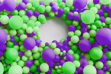 background of balloons in green and lilac. place for inscription