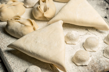 Traditional oriental, Uzbek cuisine, chuchvara, manti and samsa, a set of dishes made in one set