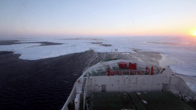 Research icebreaker cruising at packed ice in Weddell Sea of Antarctica during winter
