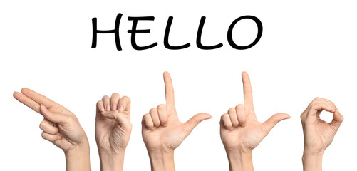 Woman showing word Hello on white background. Sign language © New Africa