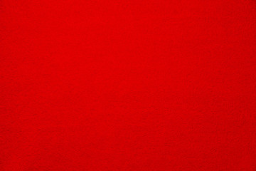 Soft bright red carpet as background, top view