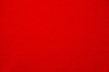 Soft bright red carpet as background, top view
