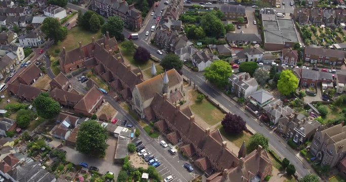 Aerial pan up reveal of Faversham town, Kent, UK