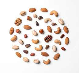 Composition with organic mixed nuts on white background, top view
