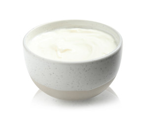 Bowl with creamy yogurt on white background