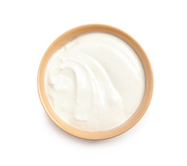Fototapeta na wymiar Bowl with creamy yogurt on white background, top view
