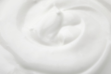 Delicious creamy yogurt as background, closeup view