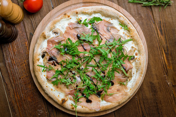 Pizza with Parma ham and arugula