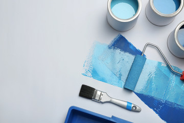Composition with paint cans and space for text on white background