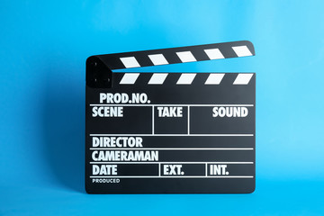 Clapperboard on color background. Modern cinema production