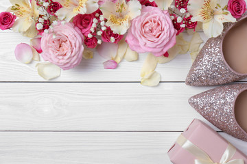 Flat lay composition with flowers and space for text on wooden background