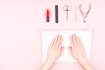 Woman hands on pink background