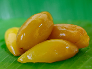 Pickled fruits or preserved sweet fruits in Thailand. Pickled Madun or Garcinia schomburgkiana Pierre fruit 