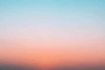 Wall murals Dawn Abstract gradient sunrise in the sky with blue and orange natural background.