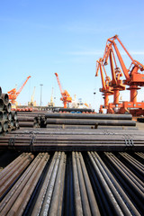 portal crane and pipes on the shipping dock