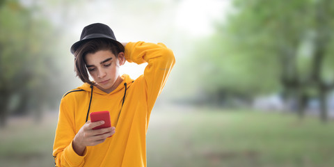 young with outdoor mobile phone