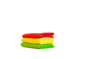 Stack of bright microfiber cloths. Isolated on white background. Place for text.