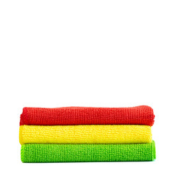 Stack of bright microfiber cloths. Isolated on white background. Place for text.