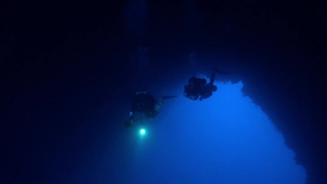 Technical divers in the Blue Hole Arch near Dahab