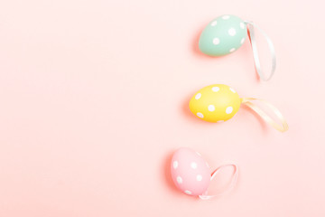 Fototapeta na wymiar Easter eggs on pink background