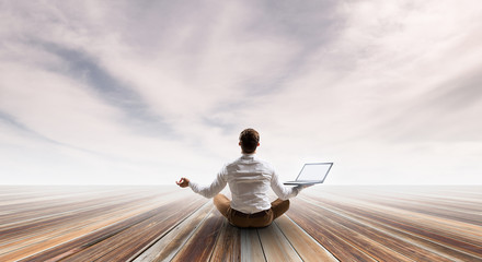 Businessman in lotus pose. Mixed media