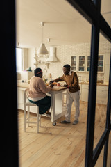 Fototapeta premium Nice married couple having breakfast in the morning