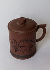 A chinese style cup with caved chinese 