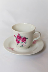 a white tea set with pattern on white background