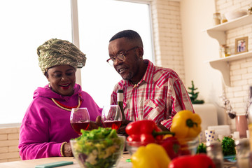 Nice delighted African couple dancing their traditional dance