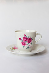 a white tea set with pattern on white background