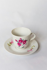 a white tea set with pattern on white background