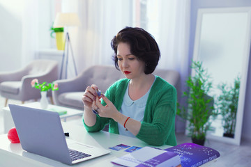 Nice good looking woman sitting at the laptop