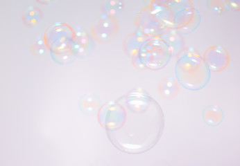 Abstract background with soap bubbles floating in the air.