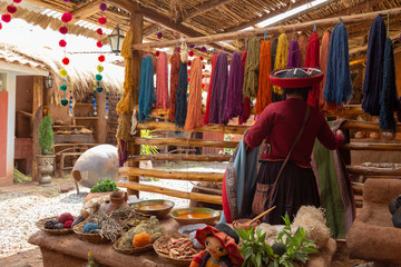Chinchero, Cusco, Peru. December 2018, Process of natural dyeing of alpaca and llama wool, Quechua woman. - obrazy, fototapety, plakaty