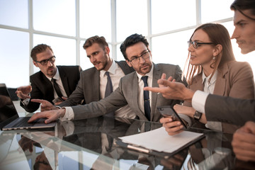 Colleagues in discussion in traders office.