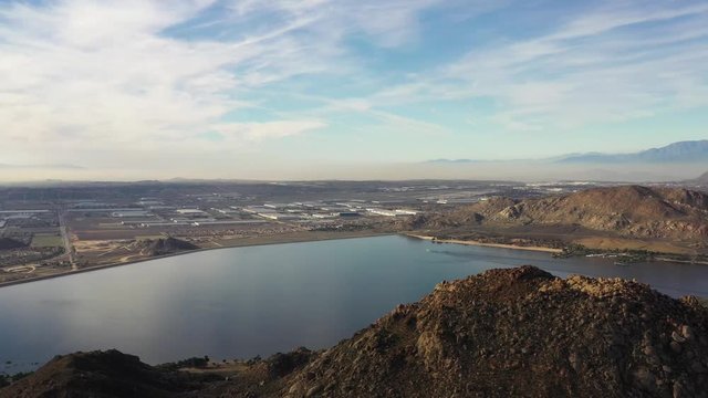 4k Drone over looking Lake Perris panning from left to right above the mountains
