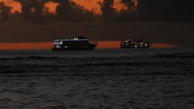 2 Dinner Cruise Ships At Sunset In Honolulu On The Island Of Oahu, Hawaii.