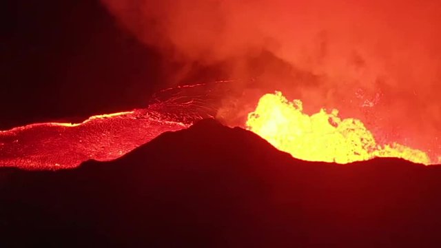 aerial view of lava spewing out of fissure