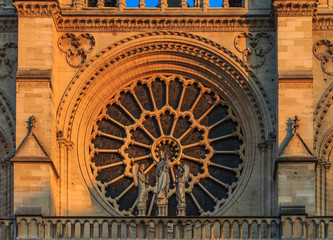Closeup of Notre Dame de Paris Cathedral facade with the oldest rose window installed in 1225 which...