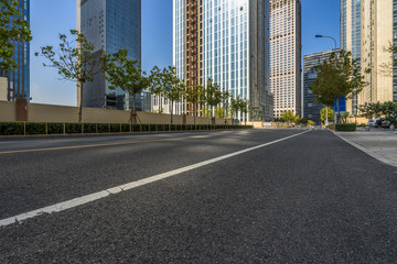 Obraz na płótnie Canvas cityscape and skyline of shanghai from empty asphalt road.
