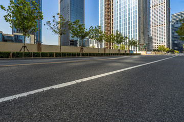 cityscape and skyline of shanghai from empty asphalt road.