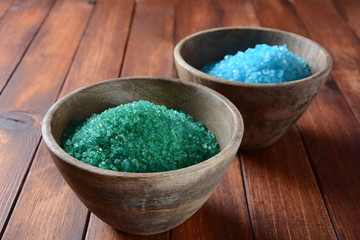 Sea shell on the colorful salt background. Spa and body care concept. Dead Sea Salt. Aromatic spa treatment. Natural ingredients for homemade body salt scrub. Beauty and skin care concept.