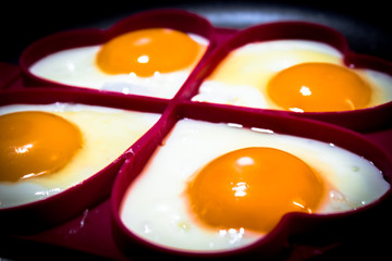 four fried eggs , yellow yolk