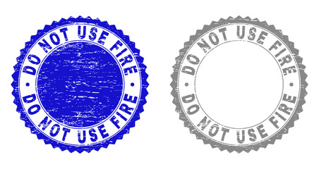 Grunge DO NOT USE FIRE stamp seals isolated on a white background. Rosette seals with grunge texture in blue and grey colors.